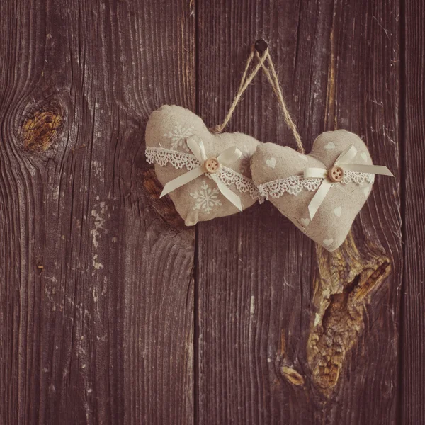 Wooden heart hanging on a branch — Stock Photo, Image