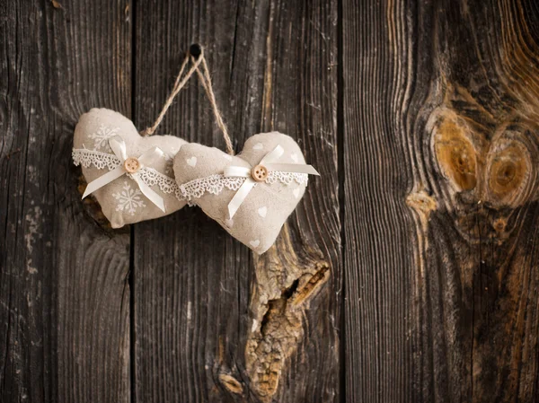 Wooden heart hanging on a branch — Stock Photo, Image