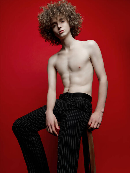 Male Model Curly Hair Posing Studio Stock Image