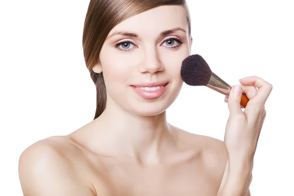 Natural cute woman with brush on cheek — Stock Photo, Image