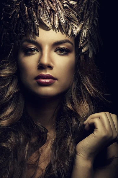 Attractive woman in hat of feathers — Stock Photo, Image