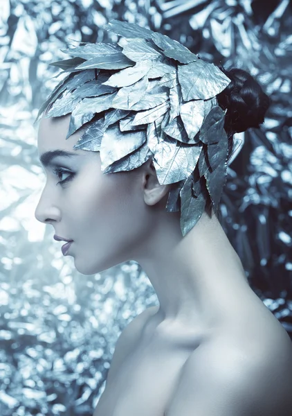 Woman with silver leaves on head — Stock Photo, Image