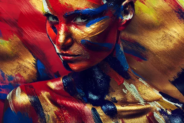 Skin of girl in colourful paint — Stock Photo, Image