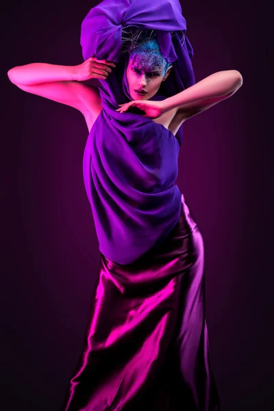 Woman in puple light — Stock Photo, Image