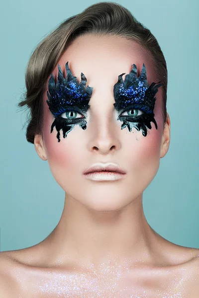 Blond woman with black makeup — Stock Photo, Image