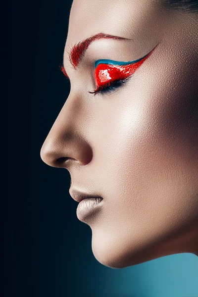 Pretty woman with red eyeshadows — Stock Photo, Image