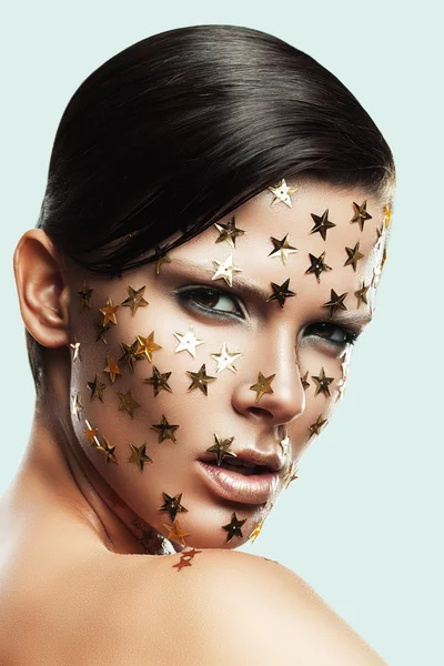 Woman with gold stars — Stock Photo, Image