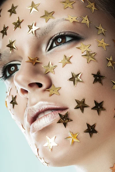 Mujer con estrellas en la cara —  Fotos de Stock