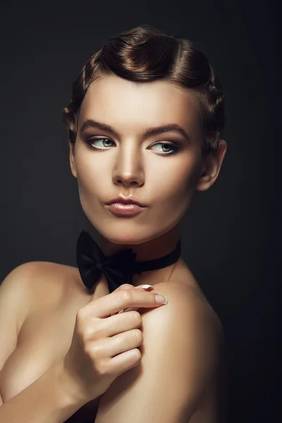 Attractive retro woman with bow — Stock Photo, Image