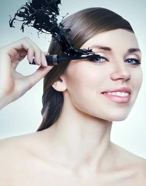 Woman with mascara brush — Stock Photo, Image