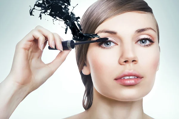 Woman with mascara brush — Stock Photo, Image