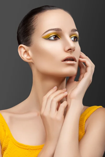 Woman with yellow makeup — Stock Photo, Image