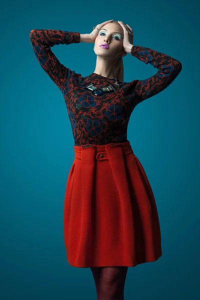 Sensual woman in a red skirt — Stock Photo, Image