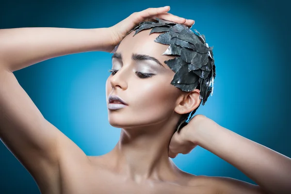 Woman in hat of silver leaves — Stock Photo, Image