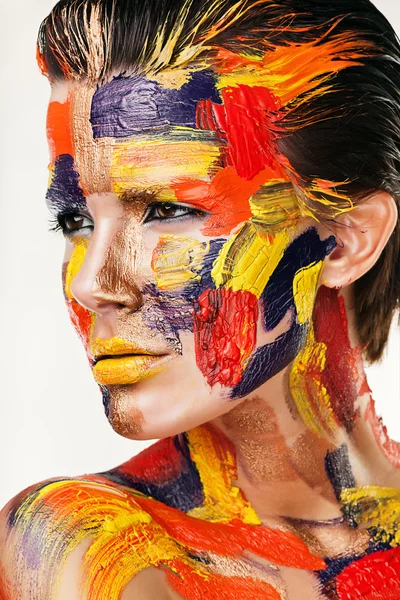 Brunette in colourful paint — Stock Photo, Image