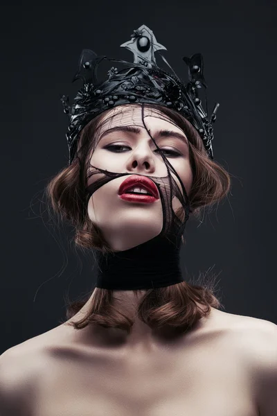 Pretty woman in dark crown — Stock Photo, Image