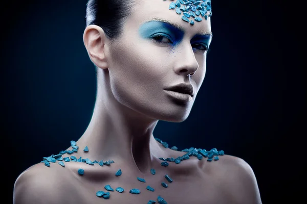 Woman with blue stones — Stock Photo, Image