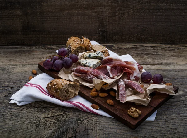 Meat selection, nuts and honey — Stock Photo, Image