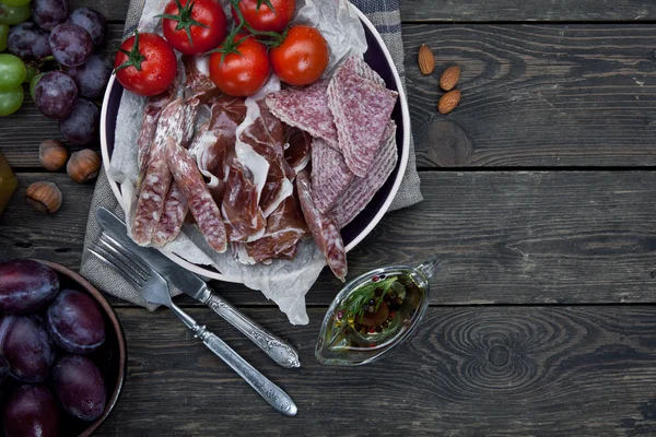 Ham with tomatoes and fruits Stock Image