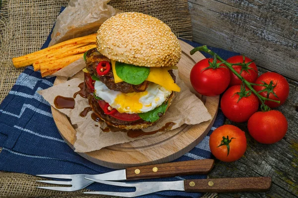 Hamburger with vegetables and spices — Stock Photo, Image