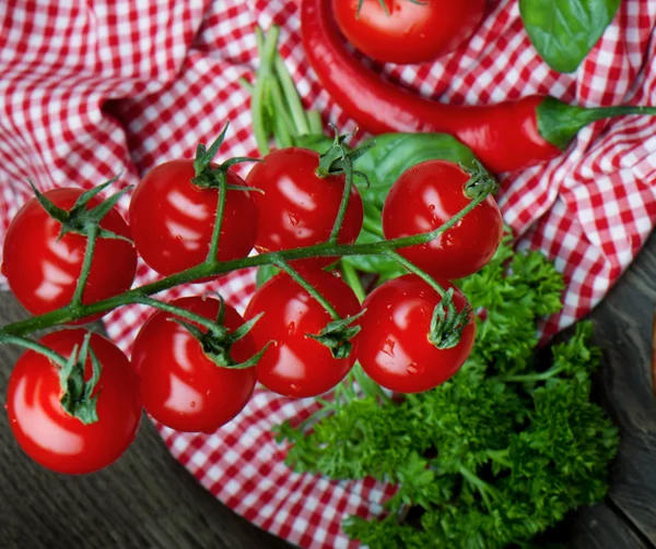 Cherry tomatoes with pepper — Stock Photo, Image