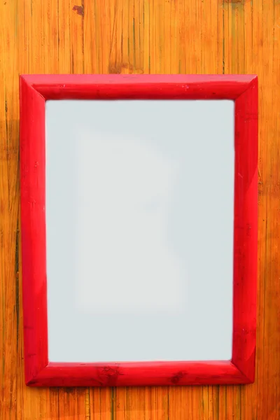 Blank wooden frame on bamboo — Stock Photo, Image