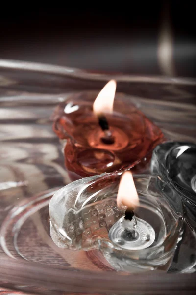 Floating burning candles in glass bowl, retro — Stock Photo, Image