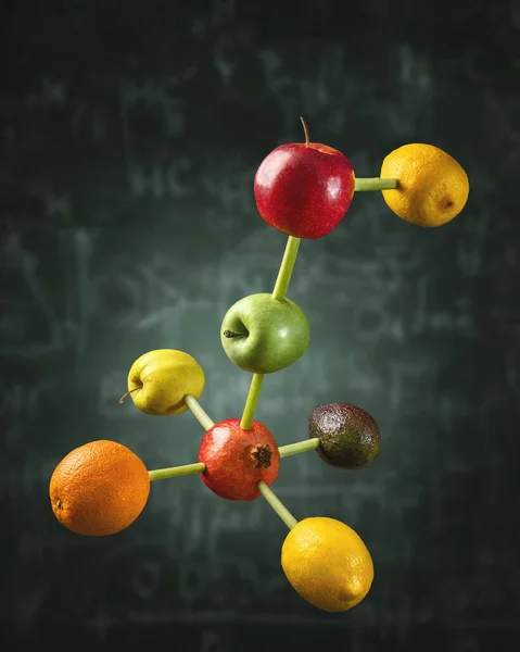 Connected fruits in the shape of molecular structure chain. Concept for vitamins diet or healthy natural food formula.