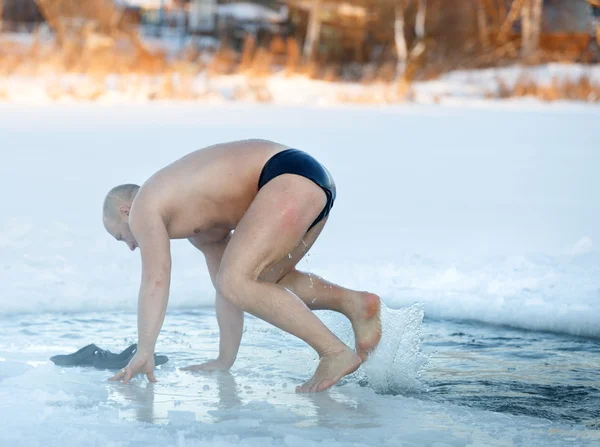 Winter swimming. Man to an ice-hole — Stock Photo, Image