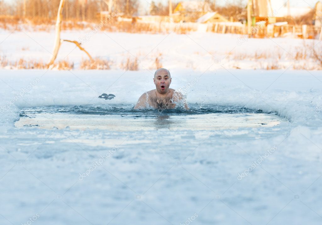 man swimming cold water