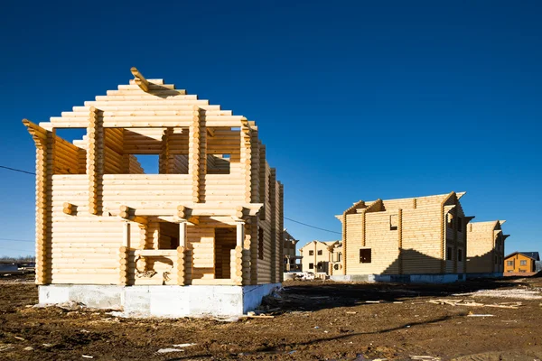 Casa de madera ecológica y área de construcción —  Fotos de Stock