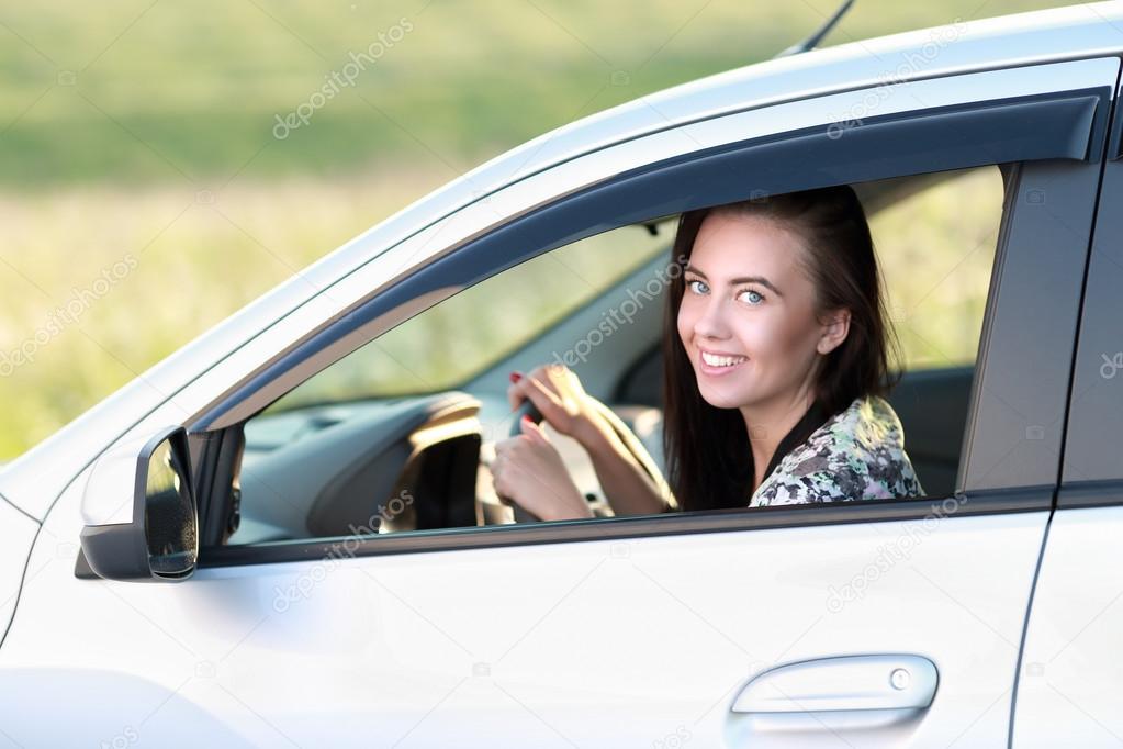 Young woman driving  car