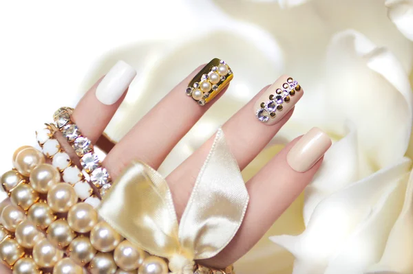 Pearl manicure with rhinestones. — Stock Photo, Image