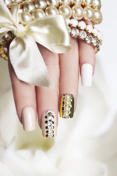 Pearl manicure with rhinestones. — Stock Photo, Image