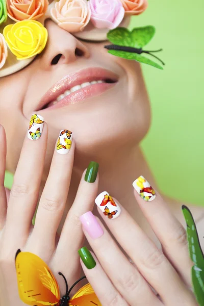 Manicure with butterflies. — Stock Photo, Image