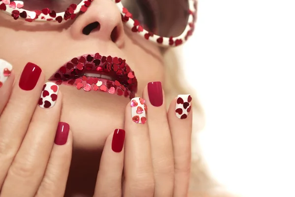 Manicure and lips with hearts. — Stock Photo, Image