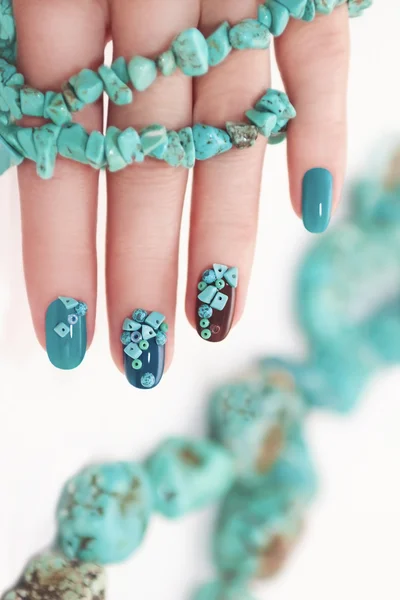 Manicure with beads and turquoise. — Stock Photo, Image