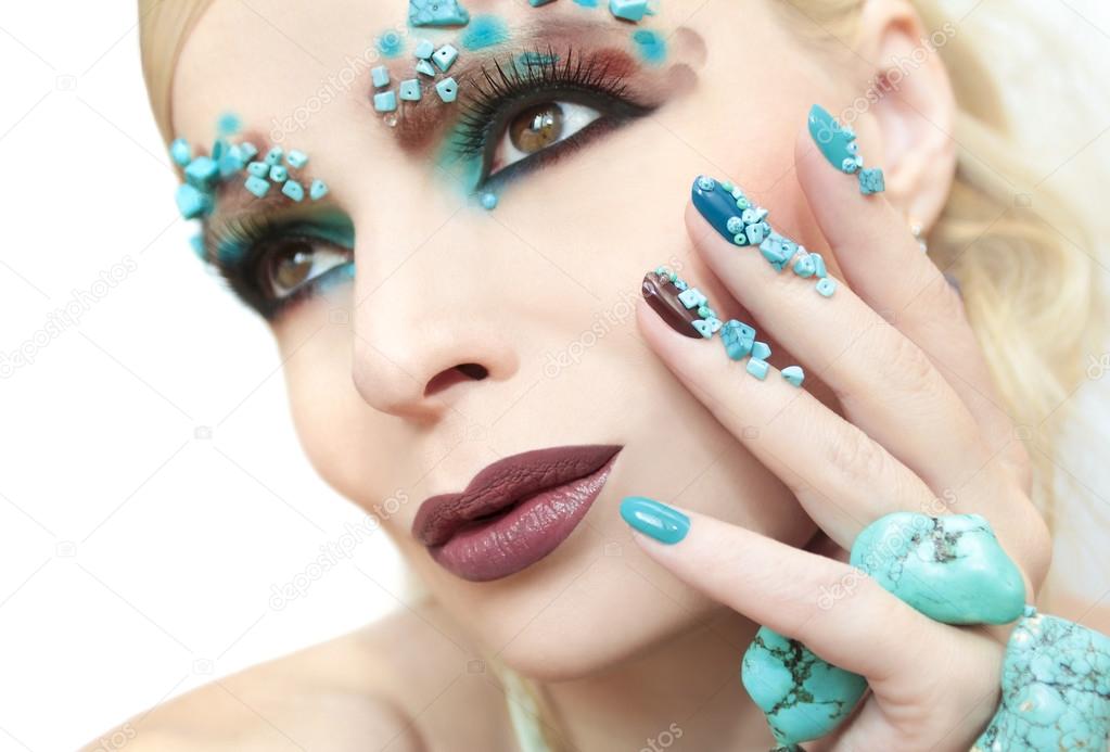 Manicure with stones of turquoise.