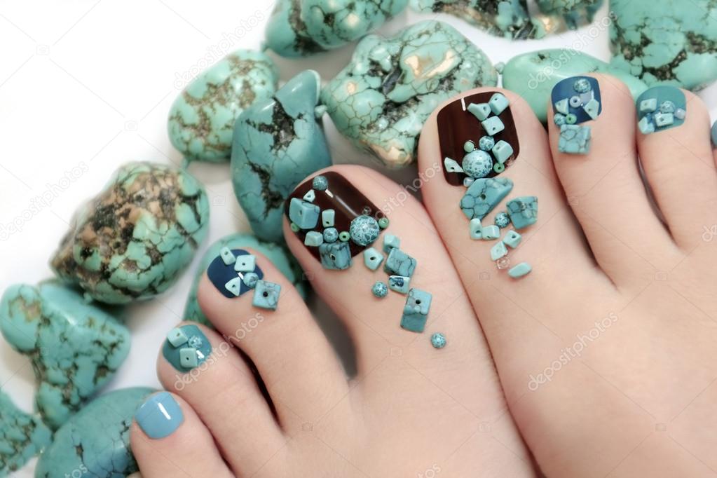 Pedicure with turquoise stones.