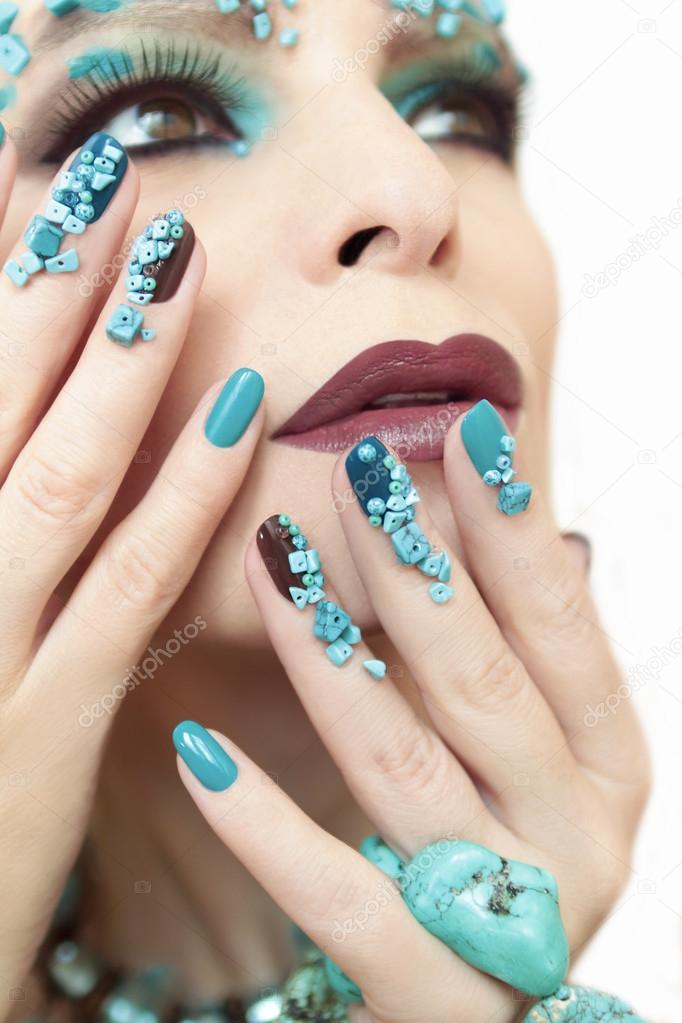 Manicure with stones of turquoise.