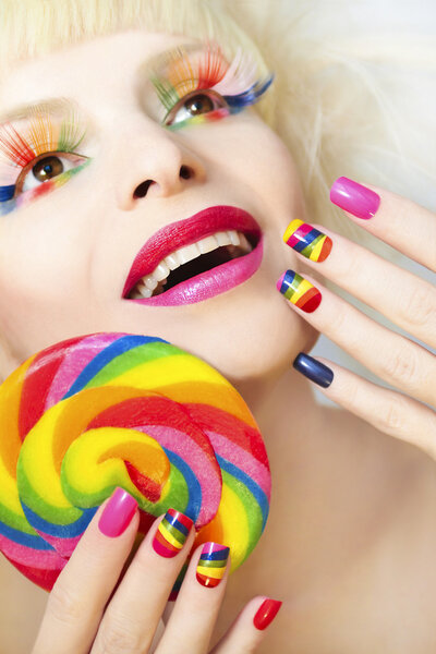 Rainbow manicure and makeup.