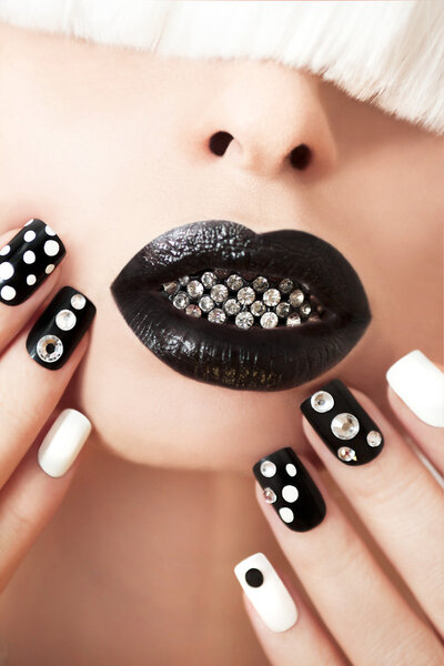 Black makeup and manicure.