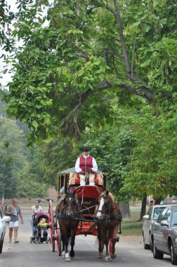 Horse-drawn carriage rides in Williamsburg, Virginia clipart