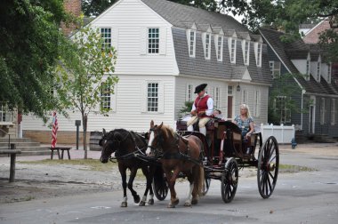 Horse-drawn carriage rides in Williamsburg, Virginia clipart