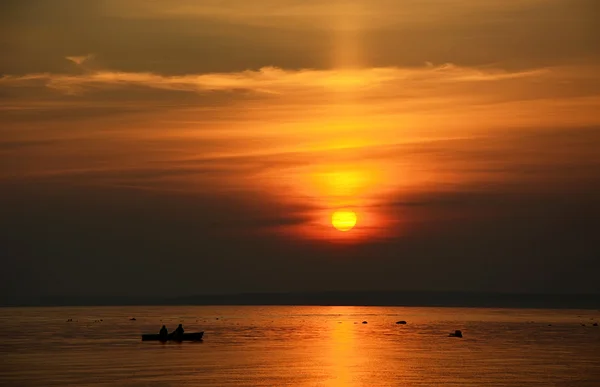 Fisherman boat at the sunset — Stock Photo, Image