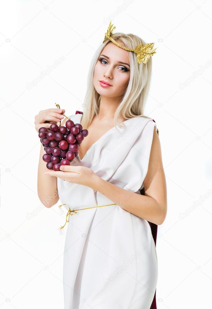 Ancient godness with a bunch of grapes. Isolated on white
