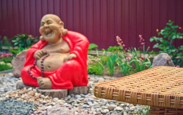 Rattan table in the garden Stock Picture