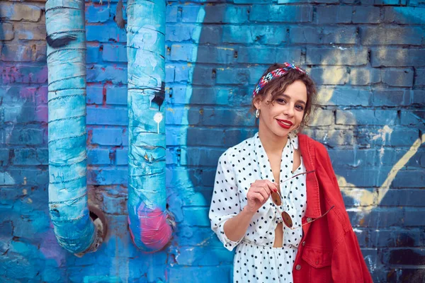 Cute Beautiful Girl White Dress Red Jacket Background Blue Brick — Stock Photo, Image