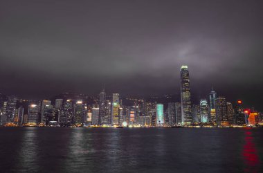 Beautiful night landscape. Skyscrapers and Victoria Harbor in Hong Kong.
