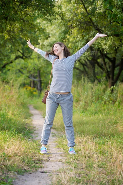 Woman in summer park — Stock Photo, Image